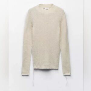 Zara alpaca-blend sweater in a light beige or ivory color with a fuzzy texture